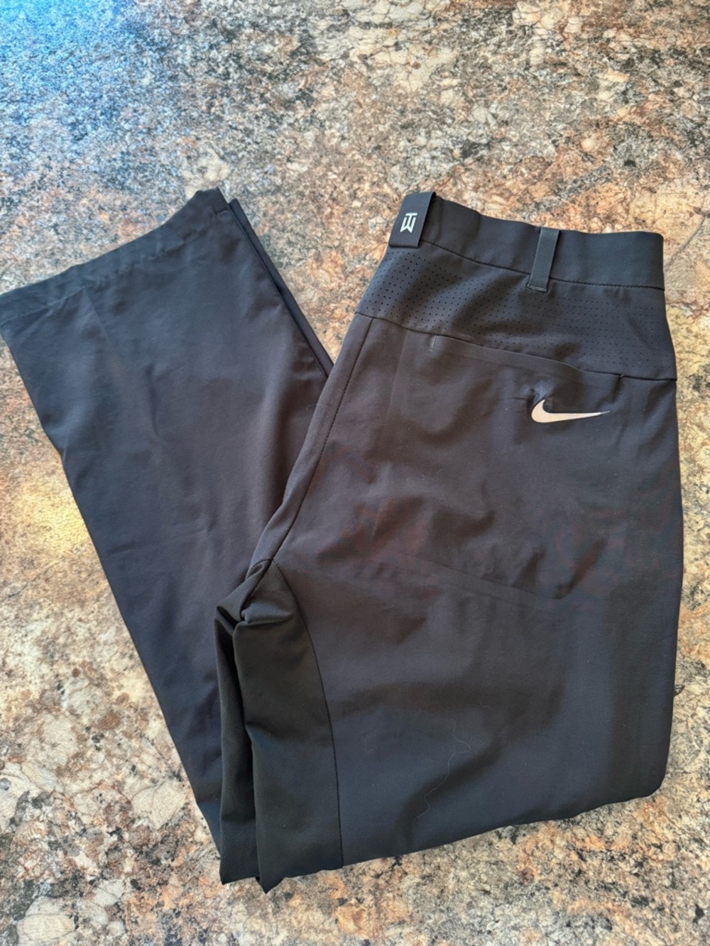 Men's Nike golf pants from the Tiger Woods Collection.